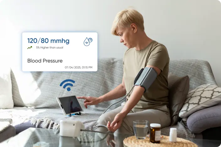 A patient checking their vital signs and transmitting to their healthcare provider with the help of the medical device